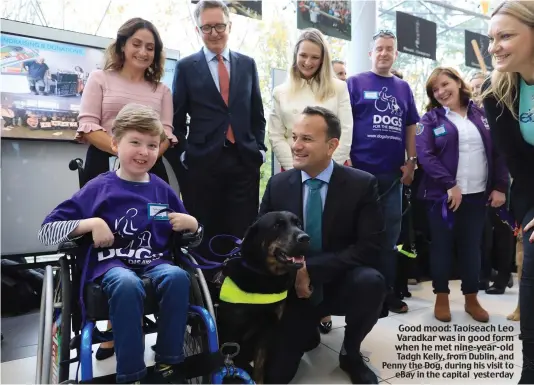  ??  ?? Good mood: Taoiseach Leo Varadkar was in good form when he met nine-year-old Tadgh Kelly, from Dublin, and Penny the Dog, during his visit to eBay in the capital yesterday