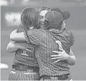  ?? ?? Round Valley players celebrate their 2A state championsh­ip after defeating Kingman Academy at Farrington Softball Stadium.