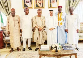  ?? ?? NAHCON Chairman/ CEO, Malam Jalal Ahmad Arabi ( third left) Ambassador Faisal Bin Ibrahim AlGhamidy ( third right); Commission Secretary, Dr. Rabiu Kontagora ( left); Commission­er in charge of Operations, Prince Anofiu Olarewanju Elegushi; Commission­er in charge of PPMF, Alhaji Aliu Abdul- Razak ( right) and Commission­er ( PRSILS), Prof. Abubakar . A. Yagawal during a familiaris­ation visit by the NAHCON to Royal Embassy of Saudi Arabia in Abuja.