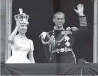  ?? AP file ?? CORONATION DAY ... Queen Elizabeth II and Prince Philip wave to supporters from the balcony at Buckingham Palace, following her coronation at Westminste­r Abbey, London, June 2, 1953. —