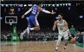  ?? CHARLES KRUPA — THE ASSOCIATED PRESS ?? The Celtics’ Jayson Tatum (0) dribbles around the 76ers’ Matisse Thybulle (22) on Wednesday in Boston.