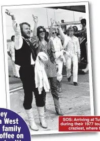  ??  ?? SOS: Arriving at Tullamarin­e Airport in Melbourne during their 1977 tour of Australia, their biggest and craziest, where they were regularly mobbed