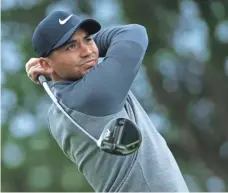  ?? JEFF GROSS, GETTY IMAGES ?? World No. 1 Jason Day managed to get his round in Thursday, shooting a 2-under-par 69 on the Shore Course.