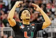  ?? Charlie Riedel / Associated Press ?? Miami guard Nijel Pack celebrates after scoring against Houston, when the Hurricanes knocked out the No. 1 seed. Miami’s women have had a similarly successful run so far.