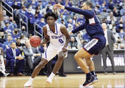  ?? Adam Hunger / Associated Press ?? Seton Hall’s Kadary Richmond drives past UConn’s Tyrese Martin during the second half Saturday in Newark, N.J.