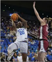  ?? RYAN SUN – THE ASSOCIATED PRESS ?? UCLA guard Charisma Osborne goes up for a shot against Washington State’s Kyra Gardner during Sunday’s game.