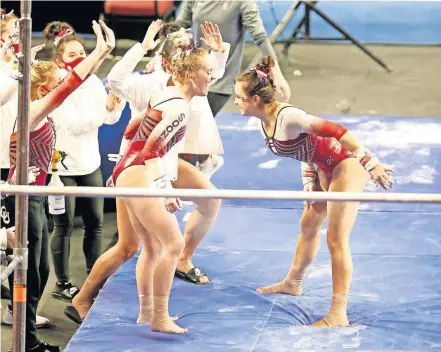  ??  ?? OU's Karrie Thomas celebrates after competing on the uneven bars during Sunday's gymnastics meet against Arizona State at Lloyd Noble Center in Norman. [SARAH PHIPPS/ THE OKLAHOMAN]