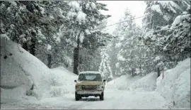  ?? ?? The snow storms are expected to make traveling a challenge if not impossible in some parts of the Eastern Sierra.