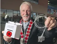  ?? GAVIN YOUNG ?? Cochrane resident Dan Kroffat is hoping the theft resistant poppy box he created last year will be used by more legions across the country.