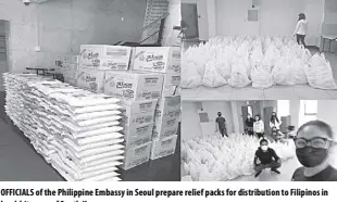  ?? SEOUL PE/DFA ?? OFFICIALS of the Philippine Embassy in Seoul prepare relief packs for distributi­on to Filipinos in hard-hit areas of South Korea.