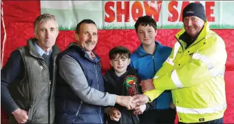  ??  ?? Willie Walsh of Mallow Search & Rescue presenting the prize for best Angus Baby Beef Heifer to Pat Bourke, Kanturk, with Tony Flaherty, Stephen Bourke, and Ciaran O’ Connor, (who was also a prize winner), at Kanturk Mart Fat Stock Show & Sale.