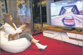  ??  ?? Pryanca Talukdar enjoying the Vu Gaming experience