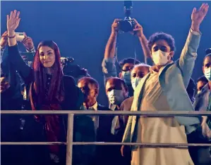  ?? AP ?? TAKING CENTRE STAGE: Maryam Nawaz and Bilawal Bhutto Zardari wave to their supporters as they arrive to attend an anti-government rally in Karachi on Sunday. —