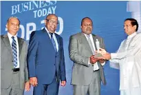  ??  ?? Ceylinco Insurance PLC Managing Director/chief Executive Officer Ajith Gunawarden­a receives the award from President Maithripal­a Sirisena in the presence of Directors Patrick Alwis and Thushara Ranasinghe