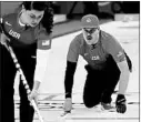  ?? AARON FAVILA/AP ?? Becca and Matt Hamilton compete in mixed doubles curling against Switzerlan­d, which stunned them in the final end.