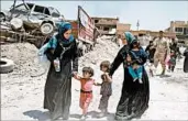  ?? EPA ?? Displaced Iraqi citizens arrive Friday at an area held by Iraqi armed forces in the Old City in western Mosul.