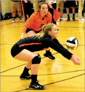  ?? Photo by Mike Eckels ?? Gravette’s Allie Callahan gets set to return the ball after an Elkins serve as teammate Kailee Midyett stands by during the Gravette-Elkins senior girls’ volleyball match at Gravette High School on Sept. 13.