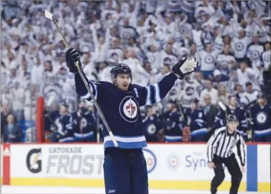  ?? The Canadian Press ?? Winnipeg Jets forward Mark Scheifele celebrates his goal against the Minnesota Wild during the second period of Game 1 in Winnipegon­Wednesdayn­ight.TheJetswon­3-2.