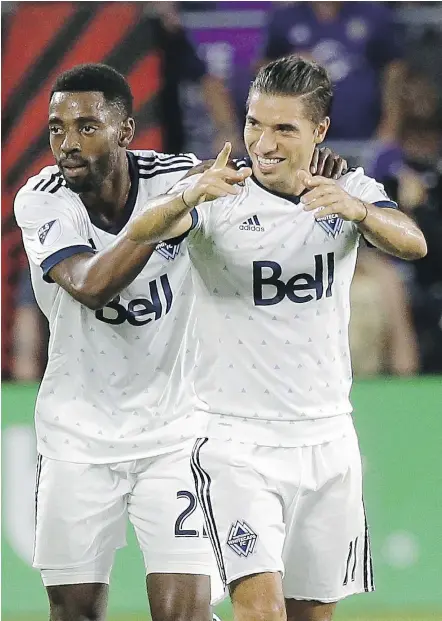  ?? — AP FILES ?? Aaron Maund, left, Nicolas Mezquida and the Whitecaps rode a rigid defensive system Saturday to a 2-1 victory in Orlando, overcoming the Florida heat and a jam-packed match schedule.