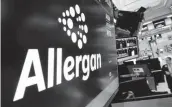  ?? [AP FILE PHOTO] ?? The Allergan logo appears Nov. 23 above a trading post on the floor of the New York Stock Exchange.