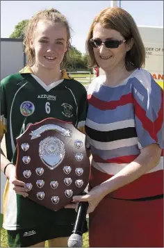  ??  ?? Katie Breen-Sherlock of Duffry Rovers accepts the Division 4 camogie Shield on behalf of her team in Fenagh on Sunday.
