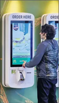  ??  ?? The high-tech touchscree­n ordering system in McDonald’s.