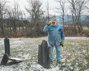  ?? Photos by Sara Naomi Lewkowicz, © The New York Times Co. ?? Frank Hull, 71, visits the family plot on his farm near Durham, N.Y. Many of the tombstones date back as far as the Revolution­ary War. Hull and his wife, Sherry, 67, can no longer handle the strenuous physical work needed to earn enough to keep up with the taxes, insurance, mortgages, barn maintenanc­e and other rising costs, so they are putting their beloved farm on the market.