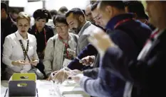  ??  ?? BARCELONA: Visitors check the new Nokia 3310 at the Mobile World Congress in Barcelona yesterday. The Mobile World Congress that started on 27 Feb will end today. — AP