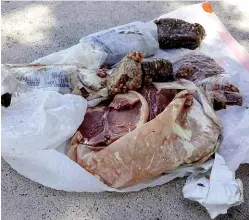  ??  ?? ABOVE: Some of the mysterious pork products that landed on Travis Adair’s roof.