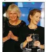 ?? AP/Frank Augstein ?? Camilla, Duchess of Cornwall (left), applauds Anna Burns after presenting her the Man Booker Prize for fiction Tuesday in London.