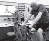  ??  ?? Left: Bridgette Hecht works out at the University of Colorado Sports Medicine and Performanc­e Center. Above: Charles Van Atta, left, helps Doug Hoffnieter with a bike fitting. Boulder Community Health teamed with UC Health and CU to build a...