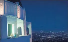  ?? Dale Robinette Lionsgate ?? THE GRIFFITH OBSERVATOR­Y, where Emma Stone and Ryan Gosling perform a fantasy dance sequence, is one of the tourist spots seen in “La La Land.”