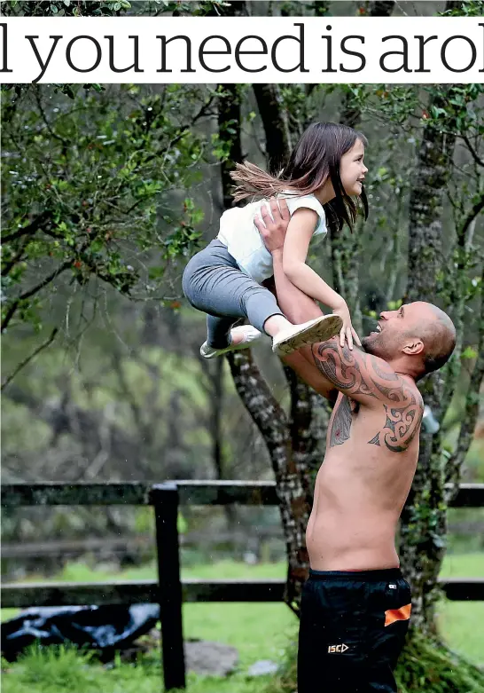  ?? DAVID WHITE / FAIRFAX NZ ?? Paul Whatuira now treasures his time with daughter Gabrielle and says he had to take control of his life for her sake. Left, Whatuira representi­ng New Zealand.