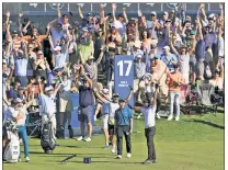  ?? Getty Images ?? AGAIN? The gallery erupts after Aaron Rai hits a holein-one on the 17th hole Saturday, the second ace on the hole at The Players Championsh­ip this week.