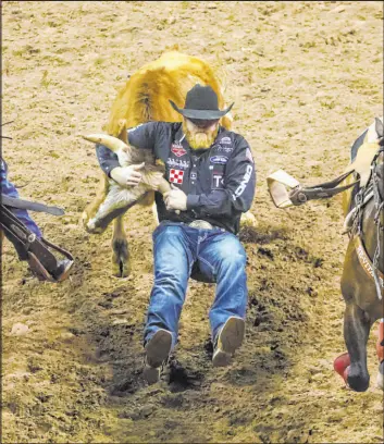  ?? Chase Stevens Las Vegas Review-journal @csstevensp­hoto ?? Will Lummus, of Byhalia, Miss., competes in steer wrestling Thursday during the first night of the Wrangler National Finals Rodeo at the Thomas & Mack Center.