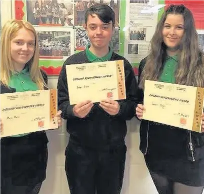  ??  ?? Macie Morris, Joseph Ridout and Lauren Argyle of Year 9 with their Accelerate­d Reader bronze awards