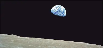  ?? AFP/GETTY IMAGES ?? A Christmas present from the moon: “Earthrise,” Apollo 8’s stunning photo on Dec. 24, 1968.