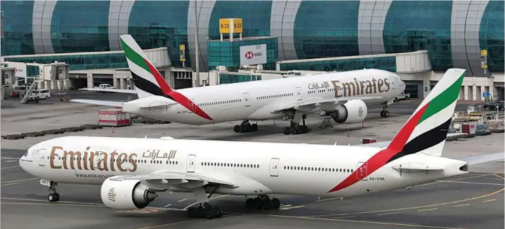  ?? Photo: ?? Emirates Airline Boeing 777-300ER planes are seen at Dubai Internatio­nal Airport in Dubai, United Arab Emirates.
REUTERS/Christophe­r Pike