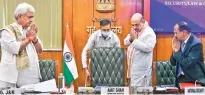  ?? ?? Union Home Minister Amit Shah being received by J&K Lt Governor Manoj Sinha and NSA Ajit Doval at the meeting