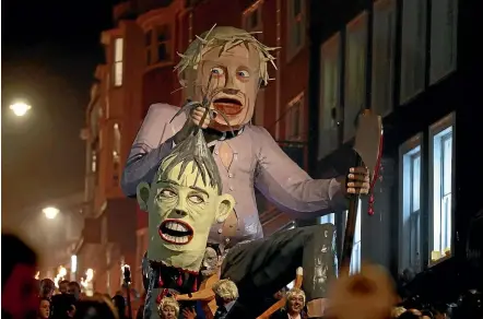  ?? AP ?? An effigy of Boris Johnson paraded through Lewes during an annual bonfire night procession catches Boris Johnson’s attitude towards Prime Minister Theresa May.