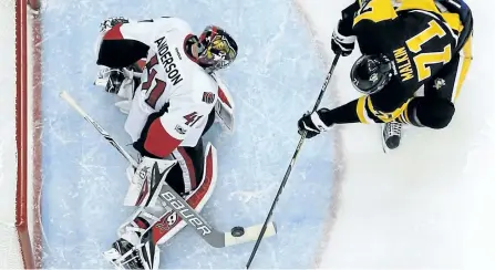  ?? GENE J. PUSKAR/THE ASSOCIATED PRESS ?? Ottawa Senators’ goalie Craig Anderson stops a shot by Pittsburgh Penguins’ Evgeni Malkin during the second period of Game 1 of the Eastern Conference final of the NHL Stanley Cup playoffs in Pittsburgh, on Saturday. The Senators won 2-1 in overtime,...