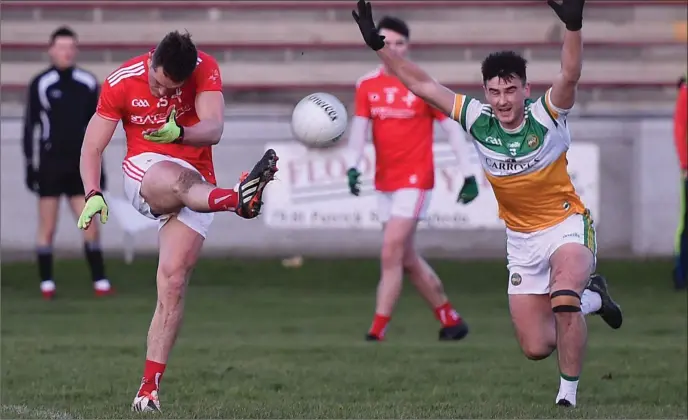  ?? Picture: Colin Bell ?? Declan Byrne goes for a score under pressure from Offaly’s Eoin Campbell during Saturday’s O’Byrne Cup game at the Gaelic Grounds.