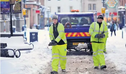  ??  ?? Winter maintenanc­e Members of one of the council’s gritting teams, pictured out and about previously