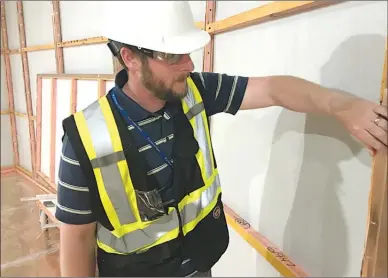  ?? Special to The Herald ?? PRH Patient Care Tower project manager Michael Morton looks at the copper insulation as part of the new MRI suite.