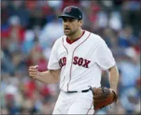  ?? MICHAEL DWYER — THE ASSOCIATED PRESS ?? Nathan Eovaldi reacts after striking out Yankees’ Gleyber Torres to retire the side during the seventh inning of Boston’s 4-1 win on Saturday.