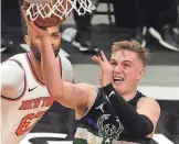  ?? GETTY IMAGES ?? Bucks guard Sam Merrill finds space near the basket March 27 against the Knicks. He had eight points, three rebounds and five assists in a season-high 28 minutes.