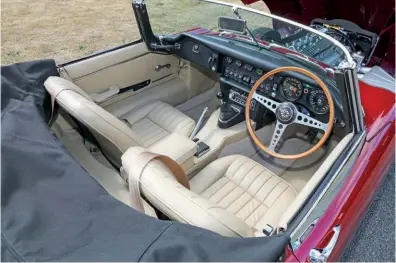  ??  ?? With the sumptuous interior beautifull­y restored but not over-restored, Mark has found the E-type a pleasure to drive and has even driven it to Le Mans. The solid Regency Red paint looks quite stunning in the sunshine.