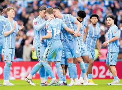  ?? Photo / AP ?? Coventry City players console Ben Sheaf after his miss in their penalty shootout loss to Manchester United.