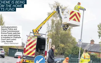  ?? TRACEY WHITEFOOT ?? Nottingham­shire’s Deputy Police and Crime Commission­er Emma Foody watches as new street lighting is installed in Chatham Court and Lovers Lane, Newark