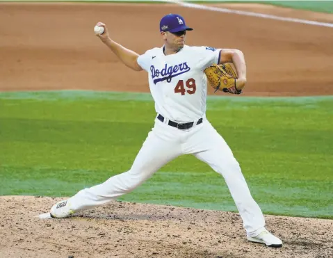  ?? Tony Gutierrez / Associated Press ?? Blake Treinen has made 27 appearance­s for L. A. this season with one save. He is well known in Oakland, where he had 38 saves in 2018.